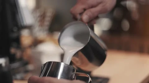 Process of preparing milk foam for cappuccino or latte Stock Footage 188906951