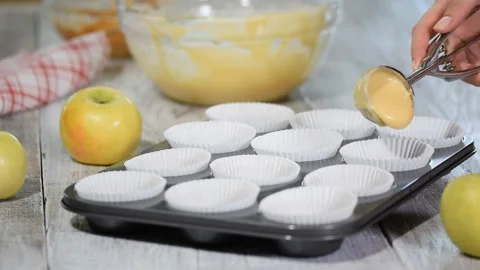 The process of preparing muffins with apple in the kitchen. Stock Footage 121788193