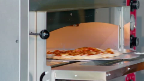 Process of preparing pizza at modern restaurant. Tasty italian meal. Stock Footage 159339176