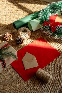 Process of preparing presents for Christmas, decorations. Paper and box with Stock Photos