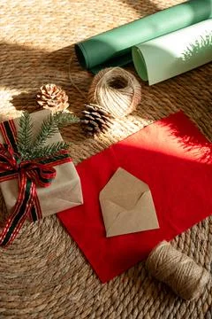 Process of preparing presents for Christmas, decorations. Paper and box with Stock Photos