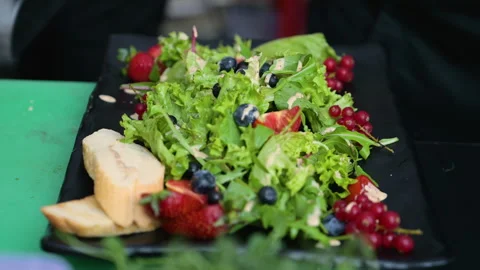 The process of preparing a salad of chicken, vegetables, herbs and fruits Stock Footage 282091762
