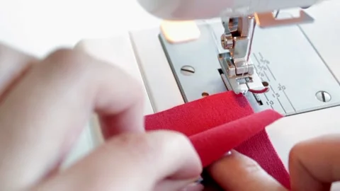 The process of preparing for sewing fabric parts on a sewing machine. Stock Footage 169751891