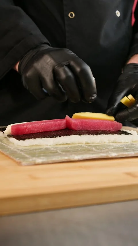 The process of preparing sushi rolls. A professional chef prepares sushi. Stock Footage 262581744