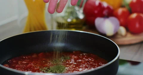 Process of preparing a tomato sauce, healthy vegetables are stewed and fried in Stock Footage 171938176