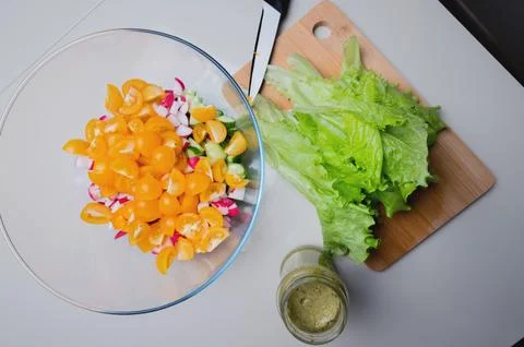 The process of preparing a vegetable salad for lunch or dinner. Food composition Stock Photos