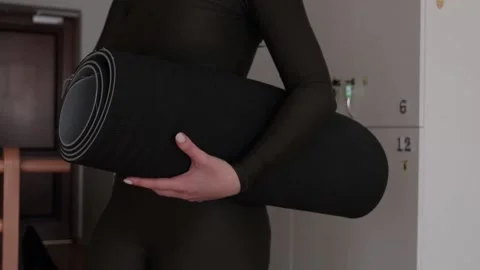 The process of preparing for a yoga lesson. Video stock 149694096