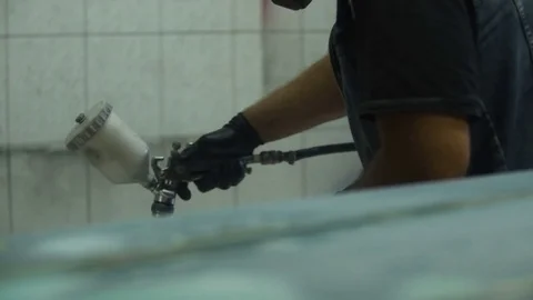 The process of priming the car before applying the paint. Car repair shop. Stock Footage 85072663