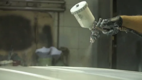 The process of priming the car before applying the paint. Car repair shop. Stock Footage 85073259