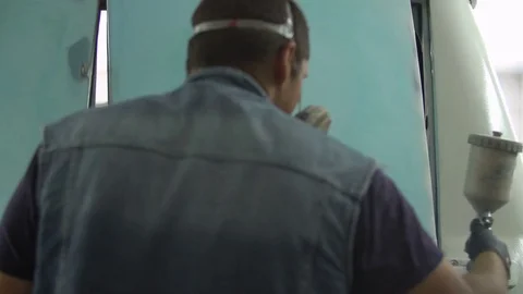 The process of priming the car before applying the paint. Car repair shop. Stock Footage 85074128