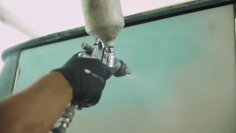 The process of priming the car before applying the paint. Car repair shop. Stock Footage 85074246