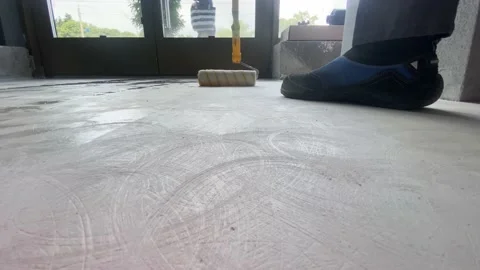 The process of priming the floor with a roller Stock Footage 186087759