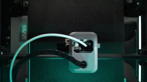Process of Printing 3D Object Inside the 3D Printer Illuminated by Blue Light Stock Footage 286243901