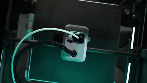 Process of Printing 3D Object Inside the 3D Printer Illuminated by Blue Light Stock Footage 286244205