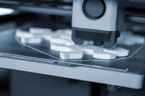 Process of printing on 3D printer. 3D printer creating model from molten plastic Stock Photos