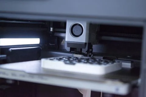 Process of printing on 3D printer. 3D printer creating model from molten plastic Stock Photos