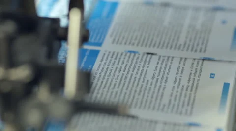 The process of printing colored  booklets in printing house Stock Footage 43739630
