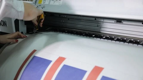 The process of printing on a large format printer. Printing wallpaper on Video stock 106762872