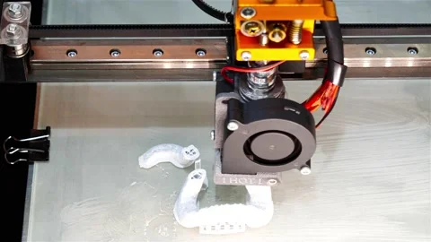 The process of printing a product on a 3D printer with white polymer Stock Footage 159742356