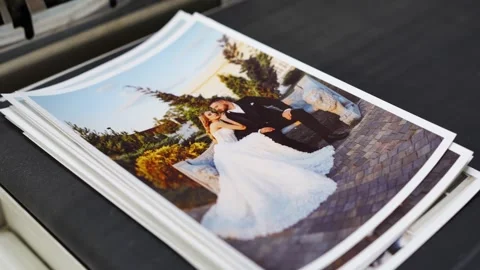 The process of printing wedding photos on a professional photo lab. Stock Footage 303410520