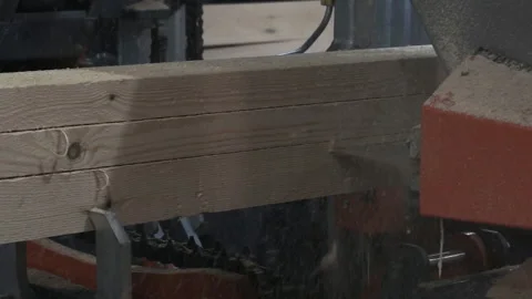 The process of processing logs in sawmill equipment. Sawing logs at sawmill equi Stock Footage 121969271