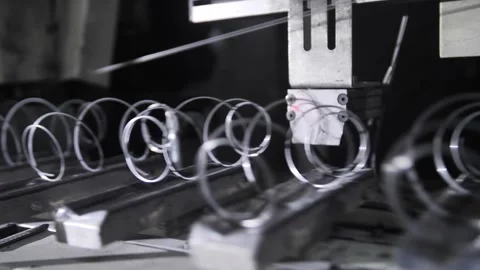 Process producing blocks of dependent springs at mattress factory indoors. Stock-Footage 240757119
