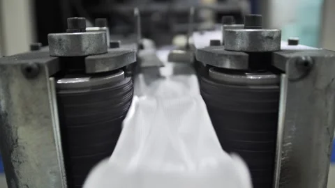 Process producing blocks of dependent springs at mattress factory indoors. Stock-Footage 240757373