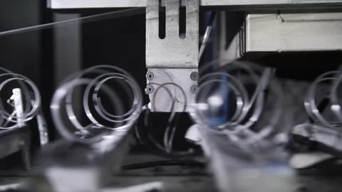 Process producing blocks of dependent springs at mattress factory indoors. Stock Footage 240757660