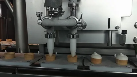 The process of production of ice cream. Hand worker taking ice cream from the 動画素材 97464816