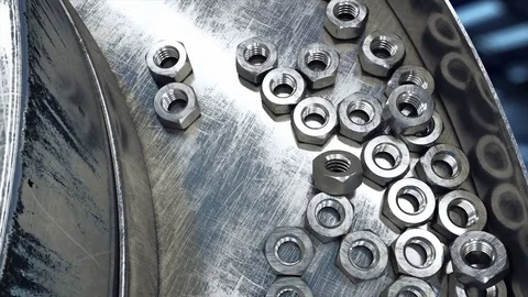 Process of production of nuts, screws. Industrial concept. Factory equipment 库存影片 73835204