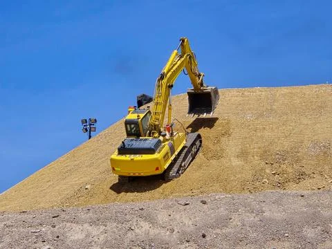 Process of profiling slopes and platforms in a leaching pad using heavy mac.. Stock Photos