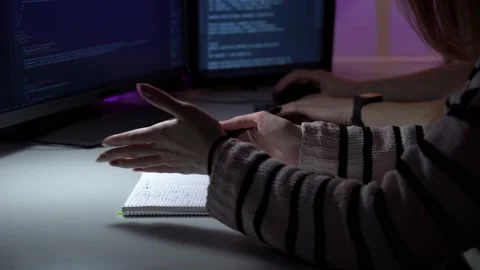 Process of programmers work who are sitting in front of computer and discussing Vídeos de archivo 151720215