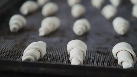 Process of putting croissants on baking tray 4K Vídeo Stock 70682862