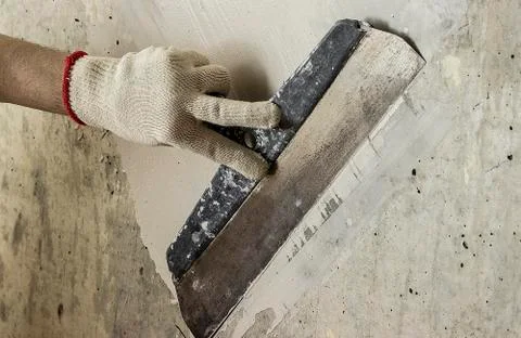 Process putty concrete wall Stock Photos