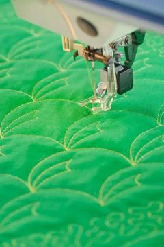 Process quilting with an electric sewing machine by using a free-motion techn Stock Photos