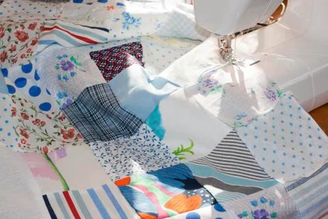 Process of quilying onpatchwork blanket Stock Photos