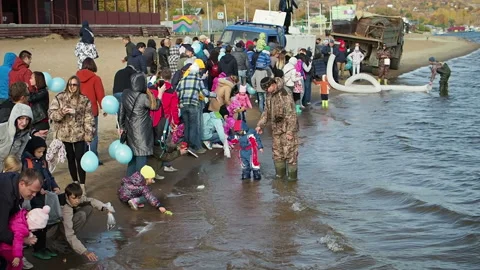 The process of releasing fish to local rivers. Russia, Saratov - october, 2018 Stock Footage 130875028