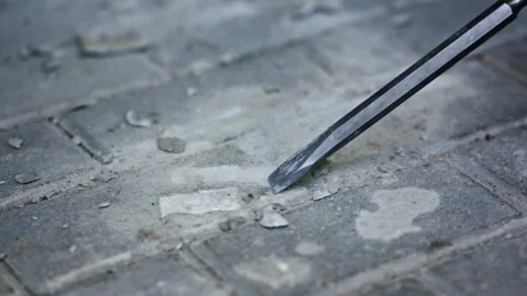 The process of removing debris and dirt from a concrete surface is done using a Stock Footage 317374564