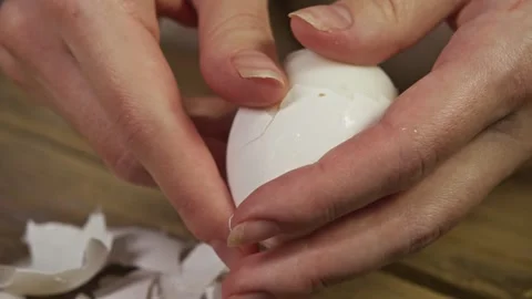 The process of removing the shell from a chicken egg. Stock Footage 301787212