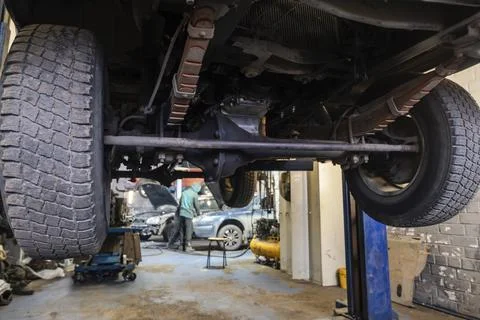 The process of repairing a car in a workshop. Stock Photos
