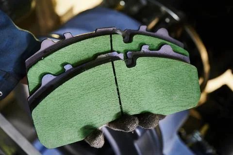 The process of replacing brake pads on a regular bus in a workshop Stock Photos