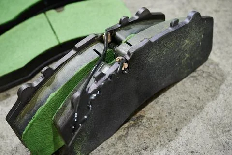 The process of replacing brake pads on a regular bus in a workshop Stock Photos