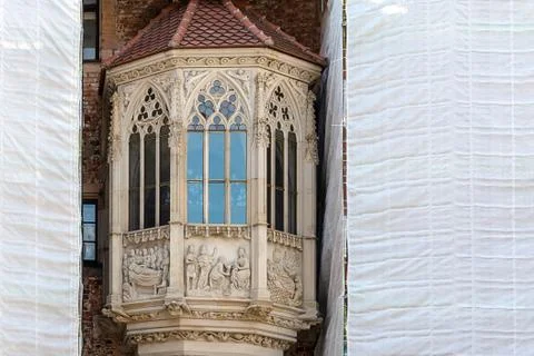 The process of restoration of a historic building in the Gothic style. Stock Photos