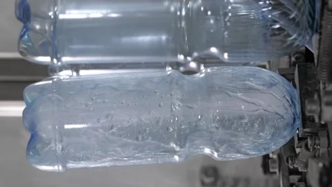 The process of rinsing plastic bottles before they go on tap. Stock Footage 234211947
