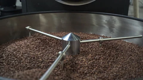 Process of roasting coffee beans inside working equipment in modern factory Stock Footage 166017714