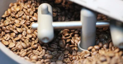 Process of roasting coffee beans involves mixing raw coffee beans roasting them Stock Footage 267083137