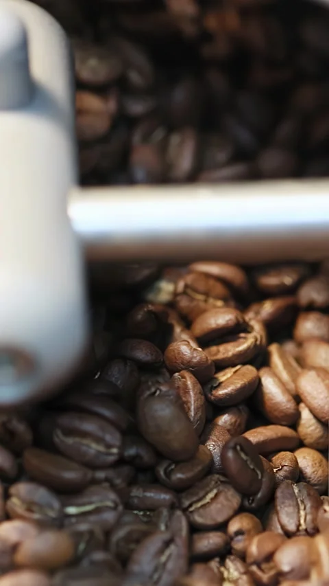 Process of roasting coffee beans involves mixing raw coffee beans roasting them Stock Footage 282231308