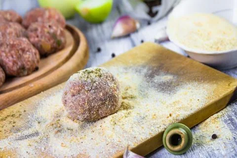 Process rolling raw meatballs breadcrumbs Stock Photos