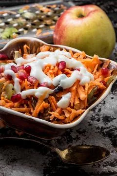 Process of rubbing fragrant ripe fruit and carrots fruit salad Stock Photos