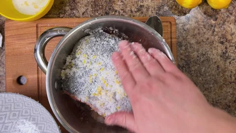 The process of salting salmon fish. The pieces of fish sprinkled with salt  Stock Footage 300453385